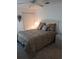 Cozy bedroom featuring a ceiling fan, neutral carpet, and closet at 8630 Ne Coral Creek Loop, Hudson, FL 34667