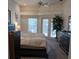 Large primary bedroom with windows and doors to the outside at 8630 Ne Coral Creek Loop, Hudson, FL 34667