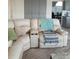 Comfortable living room featuring a plush, reclining sofa with built-in cup holders at 8630 Ne Coral Creek Loop, Hudson, FL 34667