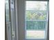 Window with view of the tree-lined yard at 8630 Ne Coral Creek Loop, Hudson, FL 34667