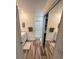 Bathroom with a walk-in shower, sliding door closet, and an extended vanity with tile backsplash at 9485 Hamlin Blvd # 8, Seminole, FL 33776