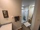 Bathroom featuring a walk-in shower and a toilet with wooden-look flooring at 9485 Hamlin Blvd # 8, Seminole, FL 33776