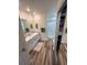 Bathroom with a walk-in shower, sliding door closet, and an extended vanity with tile backsplash at 9485 Hamlin Blvd # 8, Seminole, FL 33776