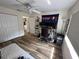 Functional bedroom featuring a desk setup, futon, and closet, with natural light at 9485 Hamlin Blvd # 8, Seminole, FL 33776