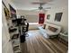 Bright bedroom with a futon, ceiling fan, and natural light creating a versatile living space at 9485 Hamlin Blvd # 8, Seminole, FL 33776