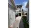 Condo exterior showing the stairway access to the second-story unit and landscaped grounds at 9485 Hamlin Blvd # 8, Seminole, FL 33776
