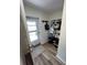 Inviting foyer with coat rack and hooks, providing practical storage and organization upon entry at 9485 Hamlin Blvd # 8, Seminole, FL 33776