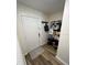 Inviting foyer with coat rack and hooks, providing practical storage and organization upon entry at 9485 Hamlin Blvd # 8, Seminole, FL 33776