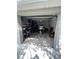 Spacious garage with ample storage space, featuring a jet ski and well-organized shelving at 9485 Hamlin Blvd # 8, Seminole, FL 33776