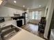 Modern kitchen featuring stainless appliances and views from a bright window at 9485 Hamlin Blvd # 8, Seminole, FL 33776