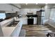 Spacious kitchen featuring white cabinets and stainless steel appliances at 9485 Hamlin Blvd # 8, Seminole, FL 33776