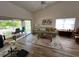 Bright living room with vaulted ceilings and a screened-in porch at 9485 Hamlin Blvd # 8, Seminole, FL 33776