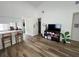 The living room features hardwood floors, a breakfast bar to the kitchen, and a television at 9485 Hamlin Blvd # 8, Seminole, FL 33776