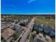 Wide aerial view showcases neatly arranged homes in a suburban neighborhood with manicured lawns and quiet streets at 10623 Marsha Dr, New Port Richey, FL 34655