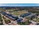 Expansive aerial view showcases a well-maintained community with landscaping, ponds, and nearby nature areas at 10623 Marsha Dr, New Port Richey, FL 34655