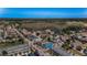 Beautiful aerial view of a vibrant neighborhood with diverse home styles and lush green spaces and trees at 10623 Marsha Dr, New Port Richey, FL 34655