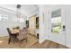 Elegant dining room features an attractive light fixture and a dining table that comfortably seats six guests at 10623 Marsha Dr, New Port Richey, FL 34655