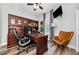 Functional office with a built-in desk, ample storage, and a comfortable leather chair at 10623 Marsha Dr, New Port Richey, FL 34655