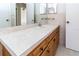 Bathroom features a vanity with a sink and a large mirror at 11001 Peppertree Ln, Port Richey, FL 34668