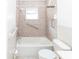 Bathroom showcasing a tub and shower combination with safety bars at 11001 Peppertree Ln, Port Richey, FL 34668