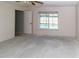 Bedroom with window with view of the pool at 11001 Peppertree Ln, Port Richey, FL 34668