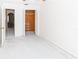 Bedroom with view into hallway and closet at 11001 Peppertree Ln, Port Richey, FL 34668