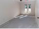 Bright bedroom with two windows and neutral paint at 11001 Peppertree Ln, Port Richey, FL 34668