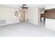Open-concept living space with view to the kitchen; ideal for entertaining and modern living at 11001 Peppertree Ln, Port Richey, FL 34668
