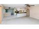 View of the living space with open access to the kitchen and hallway offering functional layout at 11001 Peppertree Ln, Port Richey, FL 34668