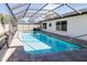 Inviting screened-in pool, perfect for relaxation and entertainment at 11001 Peppertree Ln, Port Richey, FL 34668