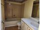 Bathroom featuring a bathtub, tile, toilet, and vanity at 11130 Carriage Hill Dr # 1, Port Richey, FL 34668