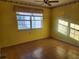 Bedroom with good natural light coming in through a large window at 11130 Carriage Hill Dr # 1, Port Richey, FL 34668
