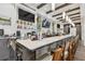Elegant bar area featuring modern lighting, comfortable seating, and well-stocked shelves at 11339 Alden Ct, Hudson, FL 34667