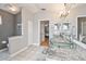 Bathroom featuring a marble vanity countertop, glass sinks, a walk-in shower and large mirror at 11339 Alden Ct, Hudson, FL 34667