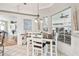 Eat-in kitchen/dining area features large windows for natural light and a wine rack at 11339 Alden Ct, Hudson, FL 34667
