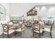 Bright dining room with multiple tables and chairs perfect for gatherings and events at 11339 Alden Ct, Hudson, FL 34667