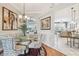 Chic dining room with elegant chandelier and stylish decor and comfortable seating at 11339 Alden Ct, Hudson, FL 34667