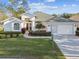 Charming single-story home featuring a well-manicured lawn and a two-car garage at 11339 Alden Ct, Hudson, FL 34667