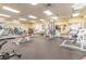 Bright gym with diverse fitness equipment, including treadmills, weight benches, and machines at 11339 Alden Ct, Hudson, FL 34667