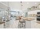 Open kitchen featuring an island with granite countertop and seating at 11339 Alden Ct, Hudson, FL 34667
