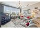 Comfortable living room with a plush sofa, large windows, and ample lighting at 11339 Alden Ct, Hudson, FL 34667