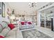 Open concept living room featuring tile floors, neutral tones, and lots of natural light at 11339 Alden Ct, Hudson, FL 34667
