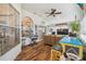 Bright sunroom with wood floors, vaulted ceilings, and plenty of windows at 11339 Alden Ct, Hudson, FL 34667