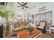 Comfortable living room/sunroom with wood floors, vaulted ceilings, and ample light at 11339 Alden Ct, Hudson, FL 34667