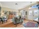 Bright living room featuring beautiful wood floors, a large window and ornate details at 11339 Alden Ct, Hudson, FL 34667