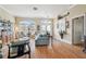 Well-lit living area featuring wood floors, a large window, and comfortable furnishings at 11339 Alden Ct, Hudson, FL 34667
