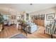 Cozy living room with hardwood floors, neutral walls and a view to the dining area at 11339 Alden Ct, Hudson, FL 34667