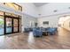 Inviting lobby features comfortable blue armchairs, elegant decor, and a bright, airy atmosphere at 11339 Alden Ct, Hudson, FL 34667