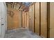 An unfinished room with exposed wood framing and open doorways at 11423 Ennis Sheard Rd, Seffner, FL 33584