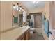 Cozy bathroom featuring a single sink vanity, toilet, and shower with modern fixtures at 1147 Monroe Ave, Brooksville, FL 34604